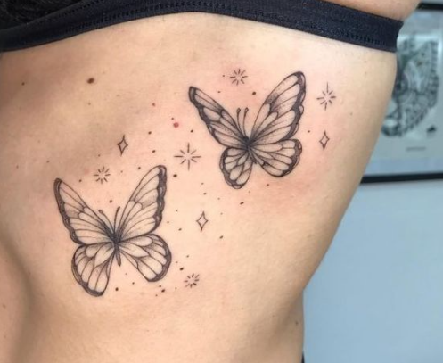 Flower And Star Butterfly Design Tattoo 